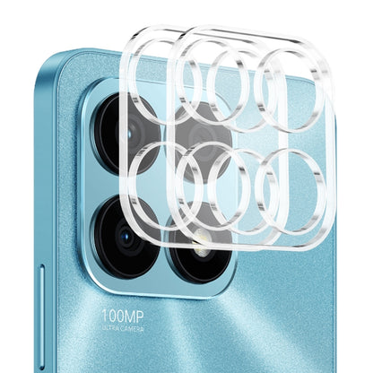 Clear tempered glass film covering four rear camera lenses on blue phone back