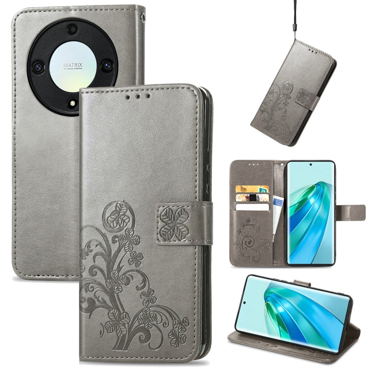 Gray leather phone case with embossed four-leaf design, clasp closure, and card slots