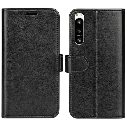 Black textured horizontal flip leather phone case with cutouts for ports and camera