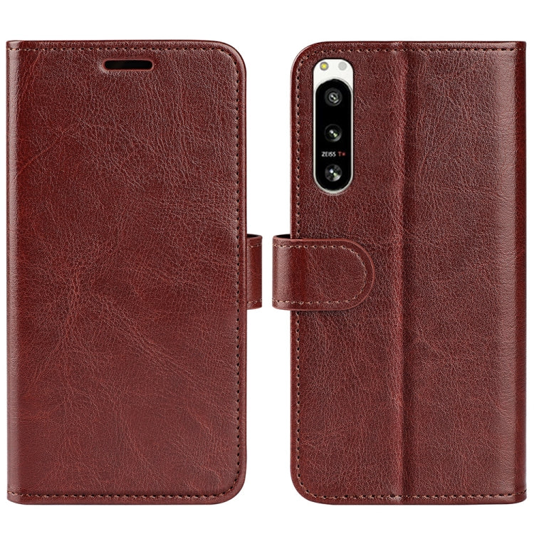 Brown textured horizontal flip leather phone case with camera cutout and strap