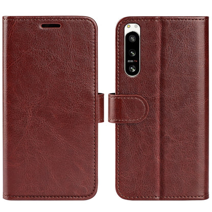 Brown textured horizontal flip leather phone case with camera cutout and strap