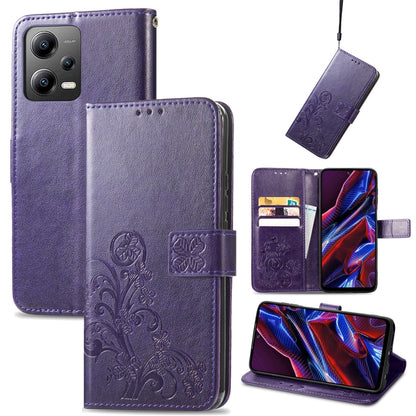 Purple leather phone case with embossed clover floral design, folio wallet with card slots