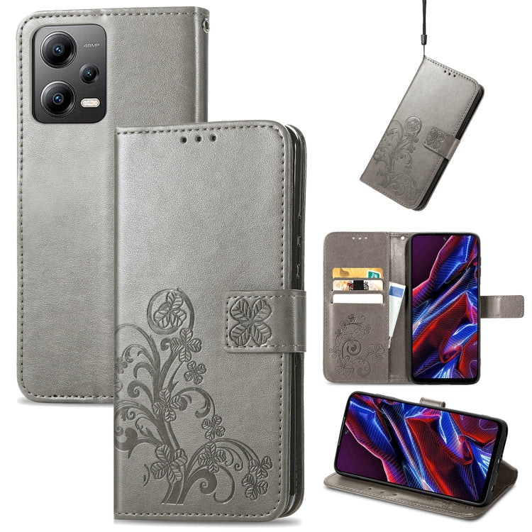 Gray leather phone case with embossed clover floral design, folio wallet with card slots