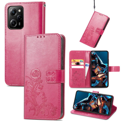 Pink embossed leather wallet phone case with four-leaf clasp and card slots