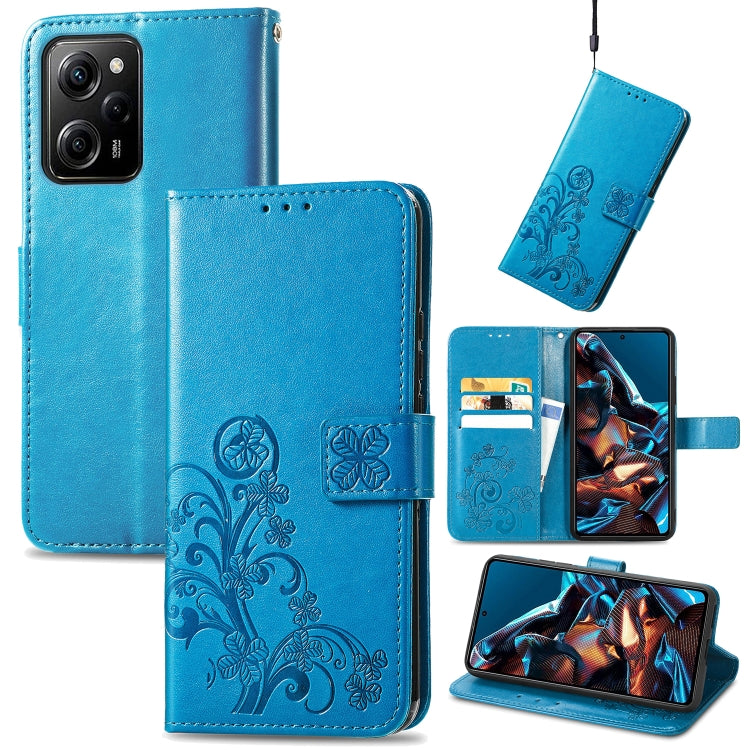 Blue leather phone case with embossed clover floral design and side card slots
