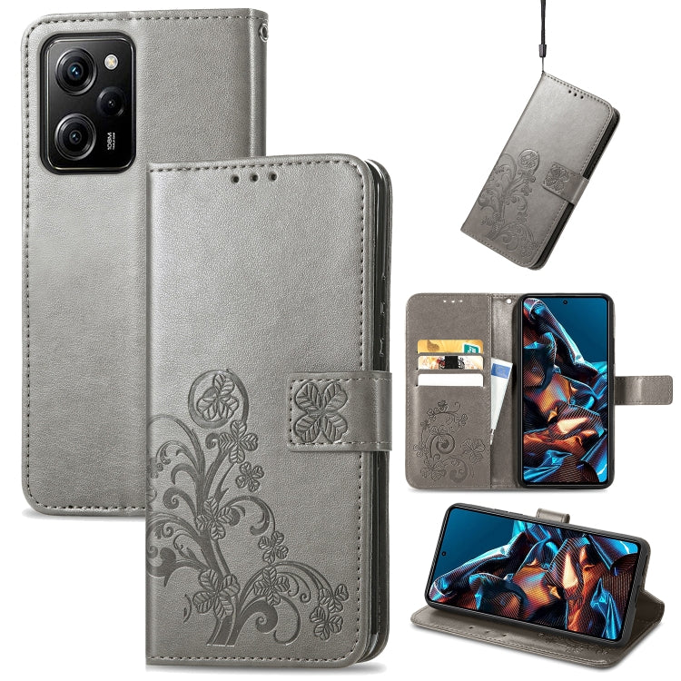 Gray leather phone case with embossed clover floral design, folio wallet with card slots