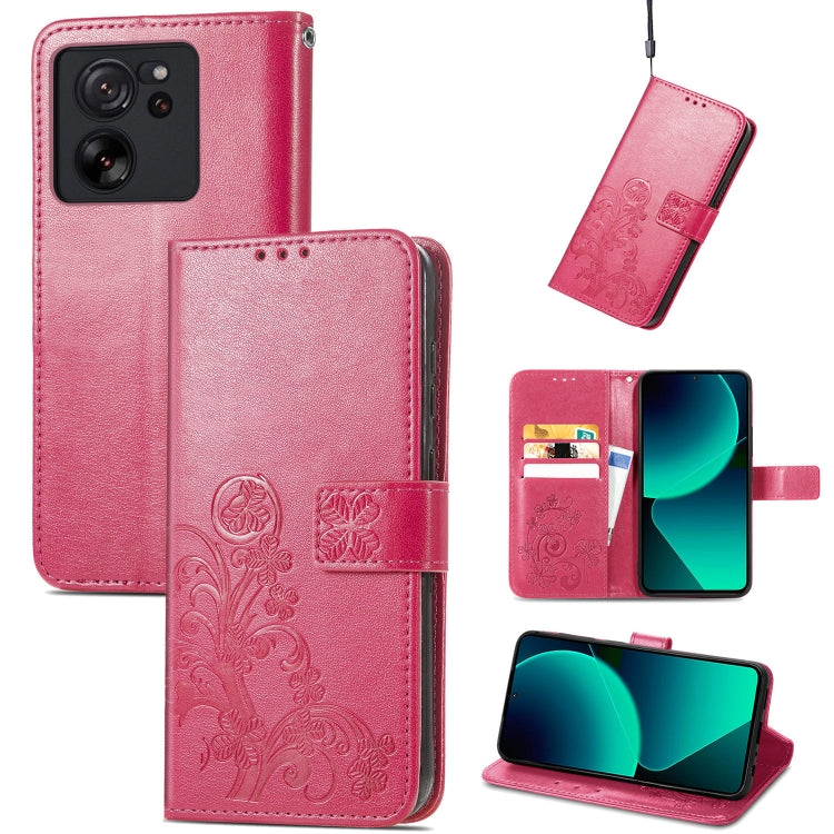 Magenta-pink leather phone case with embossed clover floral design, folio wallet and card slots