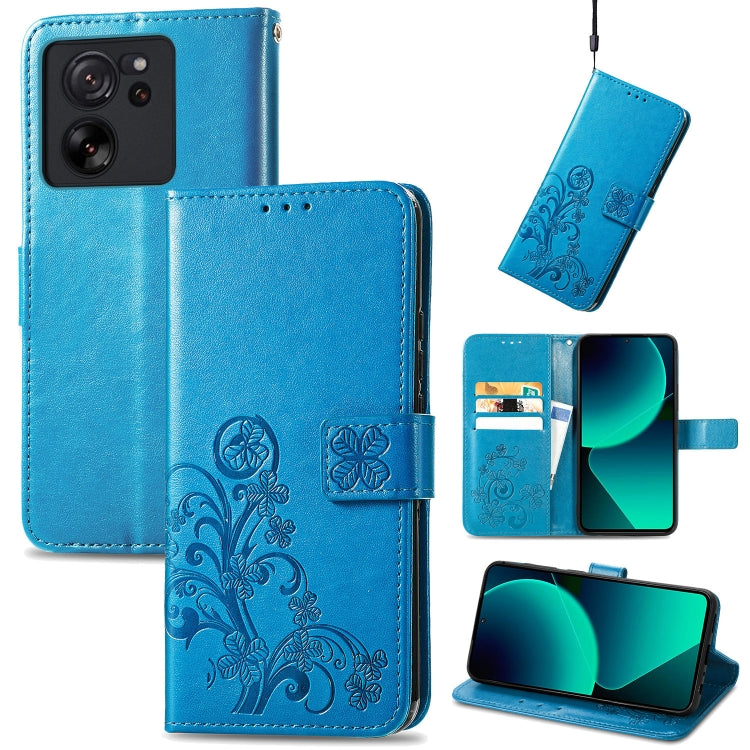 Blue embossed leather folio phone case with four-leaf clasp and card-slot cutouts