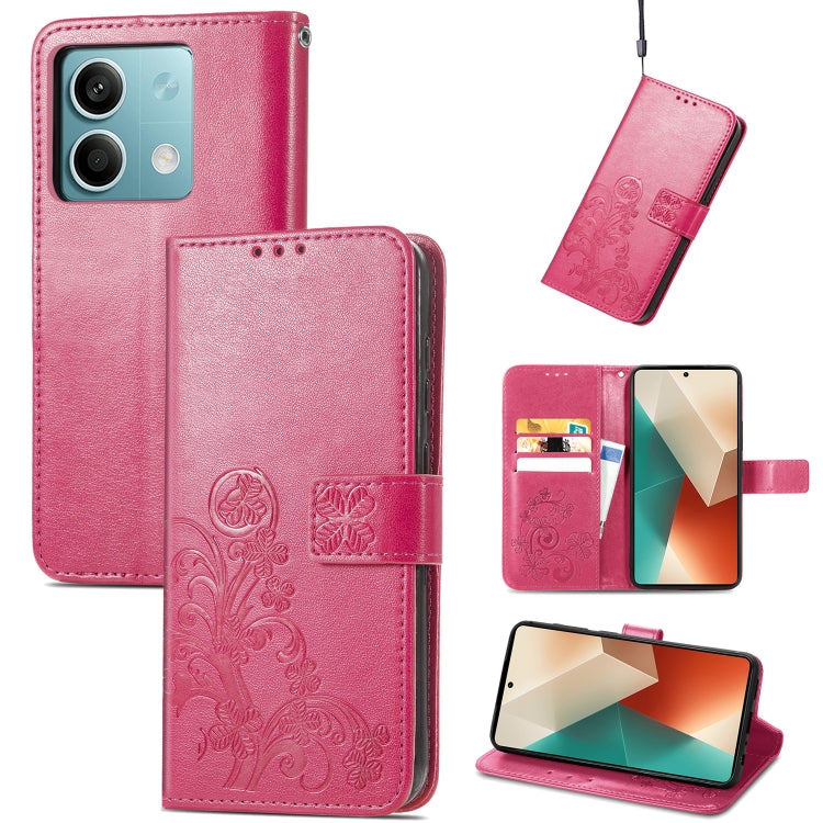 Pink four-leaf embossed leather wallet phone case with magnetic clasp and embossed floral details.