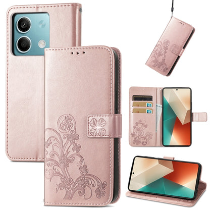 Light pink four-leaf embossed leather wallet phone case with magnetic clasp and embossed floral details.