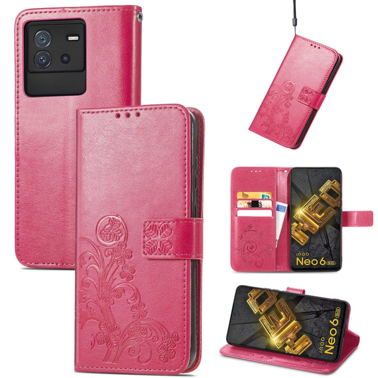 Magenta embossed leather phone case with four-leaf clasp buckle and card slots, flip style