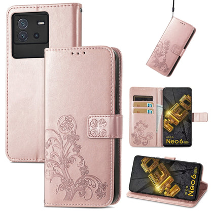 Rose-pink embossed leather phone case with four-leaf clasp buckle and card slots, flip cover