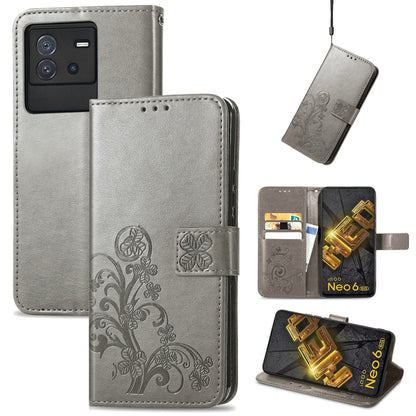 Gray leather wallet phone case with floral embossed clasp and card slots