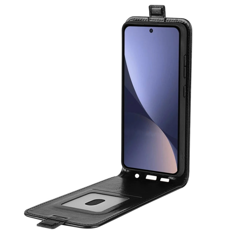 Black textured vertical flip leather phone case opened to show card pocket and front cover