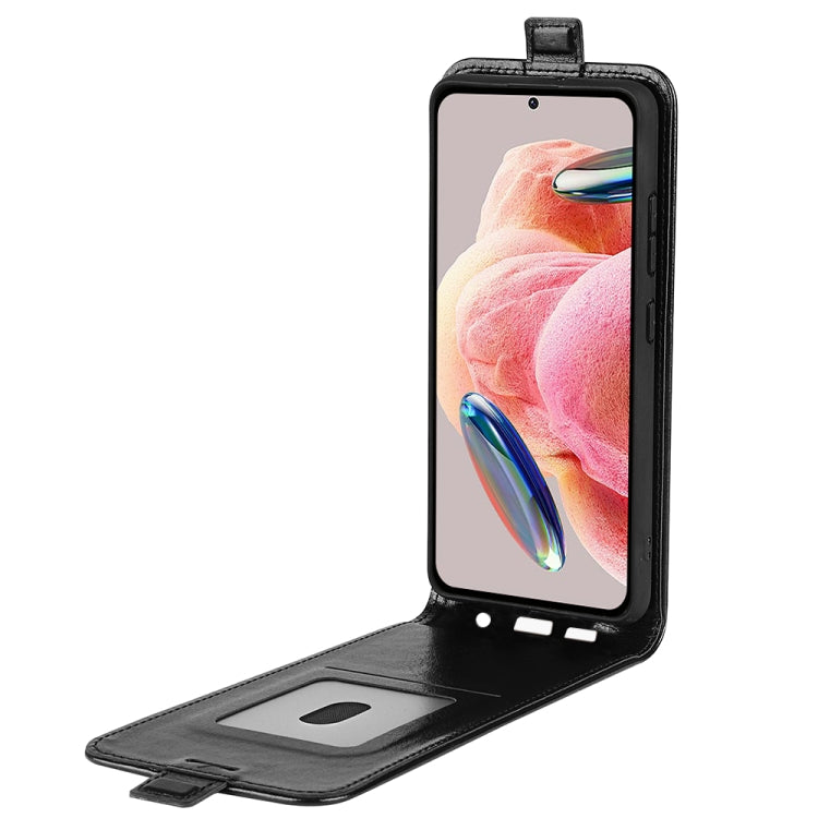 Black leather flip phone case with open stand and card slot.