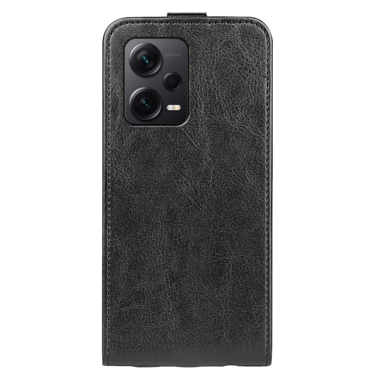 Black textured leather vertical flip phone case with camera cutout on back