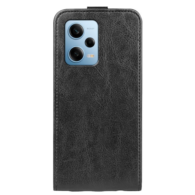 Black textured leather flip phone case showing camera cutout on front cover