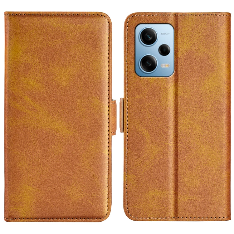 Tan leather flip phone case with magnetic buckle and camera cutout for phone.