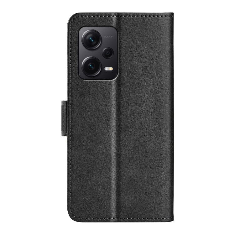 Black leather flip phone case with camera cutout and magnetic closure tab.