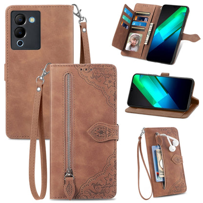 Brown embossed flower leather phone case with zipper, wrist strap, and card slots