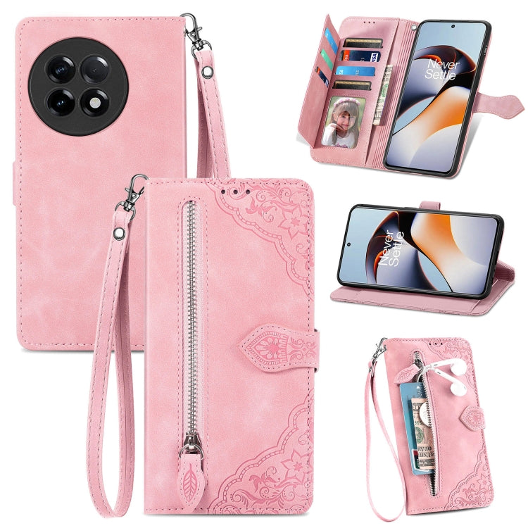 Pink embossed flower leather phone case with zipper pocket, card slots, and wrist strap