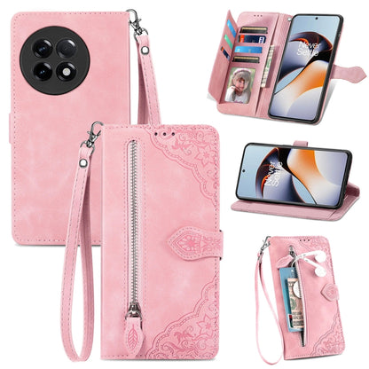Pink embossed flower leather phone case with zipper pocket, card slots, and wrist strap