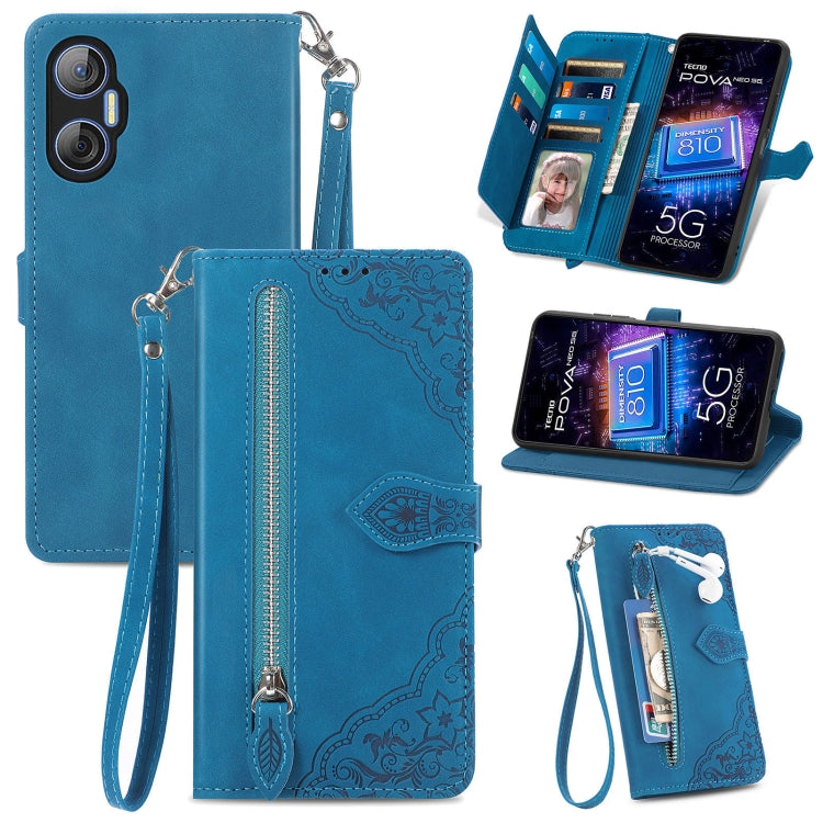Blue leather phone wallet case with embossed floral pattern and wrist strap, zipper closure, slots.