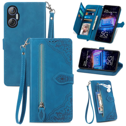 Blue leather phone wallet case with embossed floral pattern and wrist strap, zipper closure, slots.