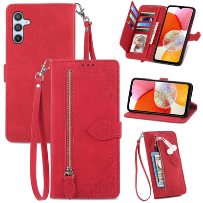 Red embossed flower leather phone case with wrist strap, zipper, and card slots