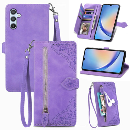 Purple embossed floral leather-style phone case with front zipper pocket and wrist strap