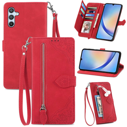 Red embossed flower leather wallet phone case with zipper closure and wrist strap
