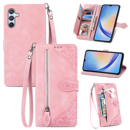 Pink embossed flower leather phone case with zipper pocket, card slots, and wrist strap