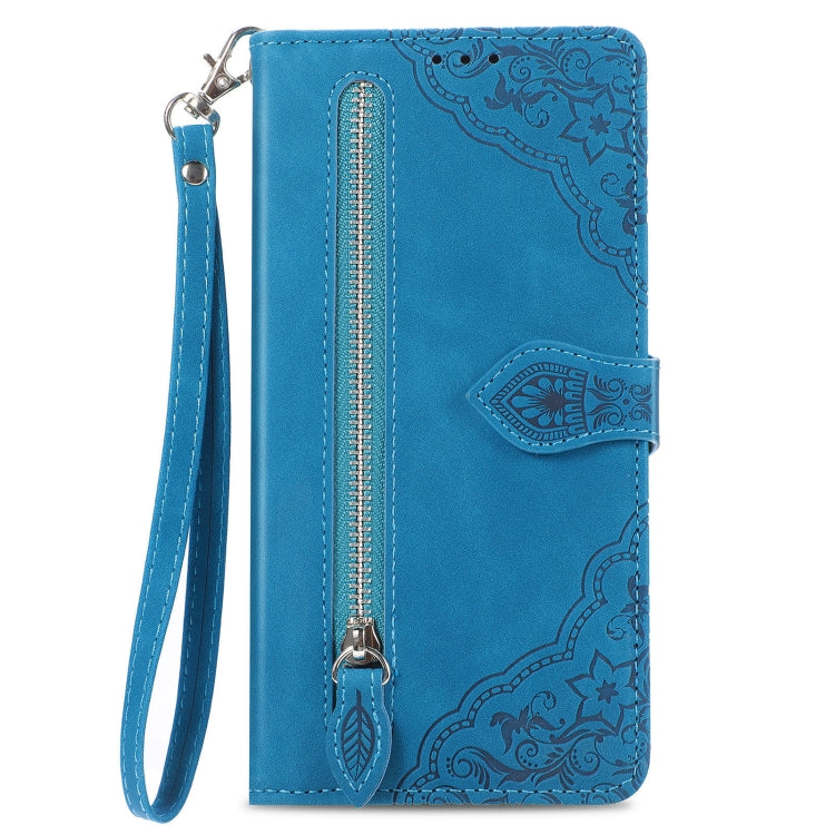 Blue embossed leather phone case with zipper pocket, wrist strap, and card holder flap
