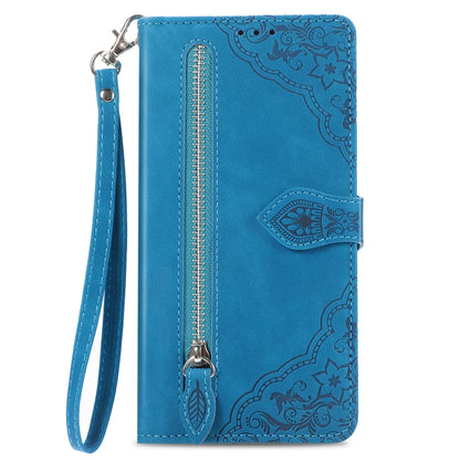 Blue embossed leather phone case with zipper pocket, wrist strap, and card holder flap