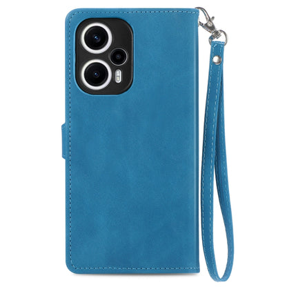 Blue leather phone case with wrist strap and cutouts for camera module