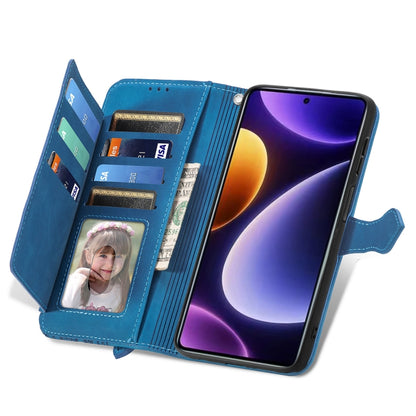 Blue wallet-style phone case with zipper pocket, card slots, and wrist strap