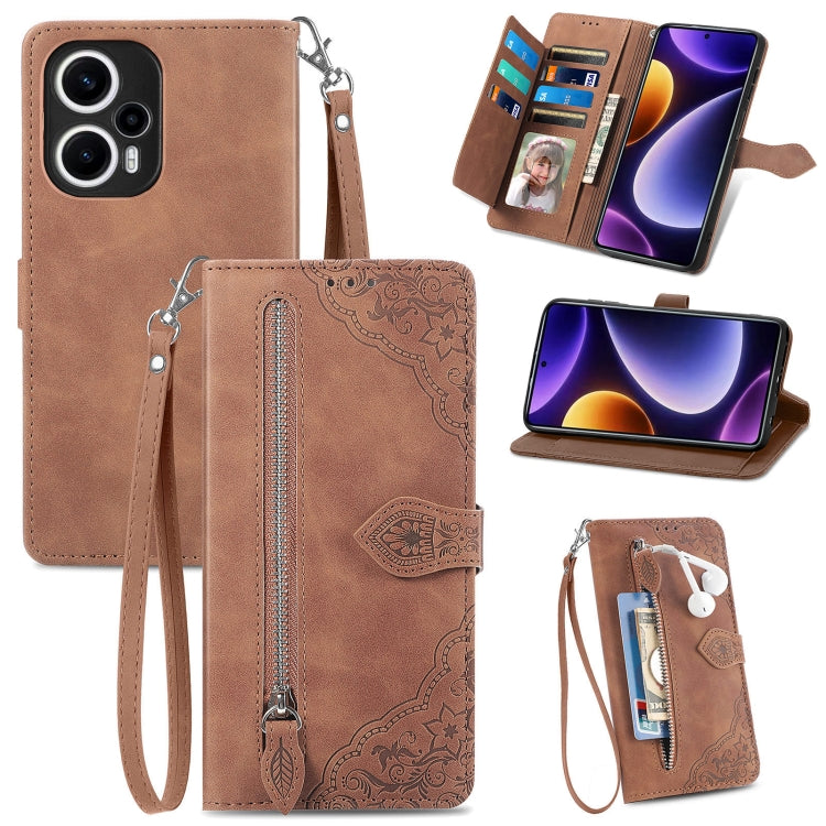 Tan-brown embossed leather phone case with zipper pocket, wrist strap, and card slots