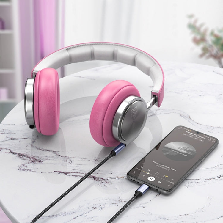 USB-C to 3.5mm audio aux cable linking smartphone to wired headphones