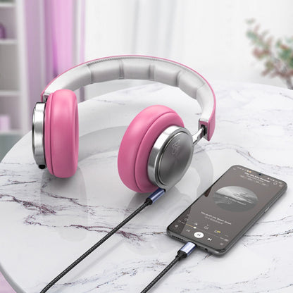 USB-C to 3.5mm audio aux cable linking smartphone to wired headphones