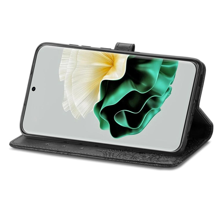 Black mandala-embossed leather phone case with folio stand view