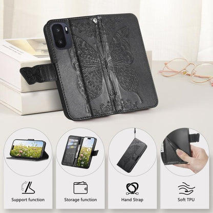 Black butterfly-embossed leather phone case with hand strap and soft TPU lining.