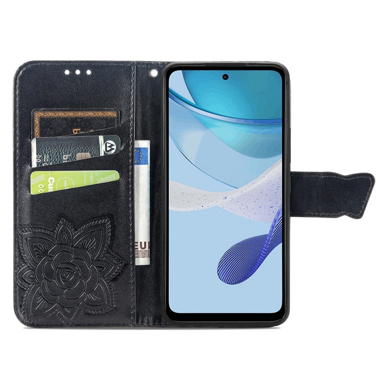 Black embossed leather wallet phone case with butterfly-and-flower design and card slots