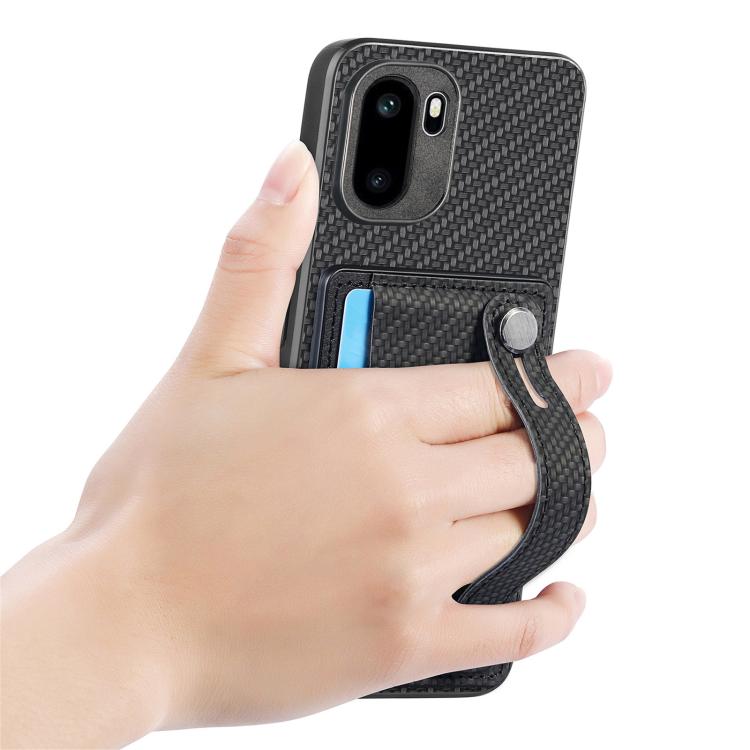 Black wallet phone case with wristband kickstand, shown held in a hand