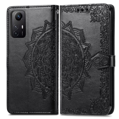 Black embossed mandala leather phone case, open front with magnetic closure band