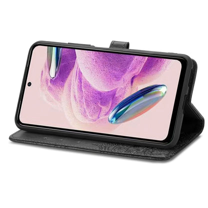Purple embossed mandala leather phone case with front cover folded into a stand