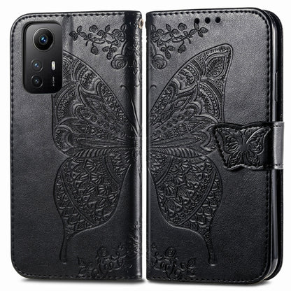 Butterfly embossed leather folio phone case with magnetic strap, black for Redmi Note 12S