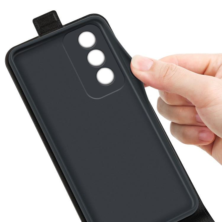 Textured black leather phone case back with camera openings, held by hand