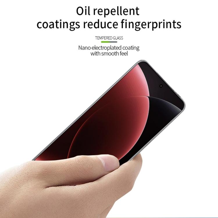 Hand applying clear tempered glass screen protector with fingerprint-resistant coating