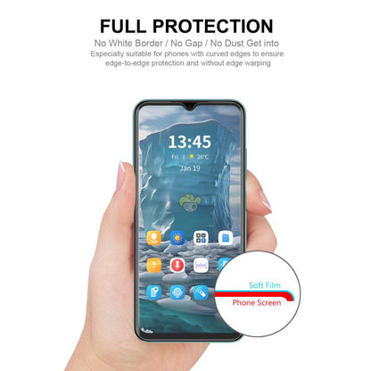 Hydrogel screen protector film being applied to a smartphone front display