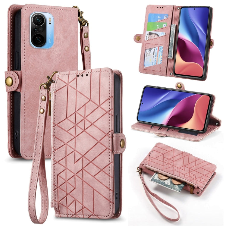 Open pink leather wallet phone case with geometric zipper front, card slots, and wrist strap.